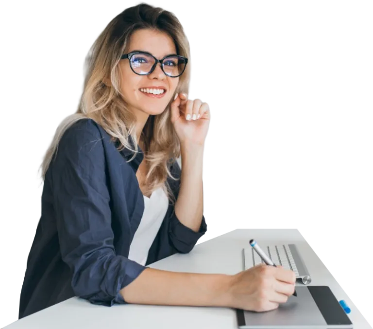 A smiling woman wearing glasses, working at a desk with a digital drawing tablet, representing a focus on excellence and efficiency.