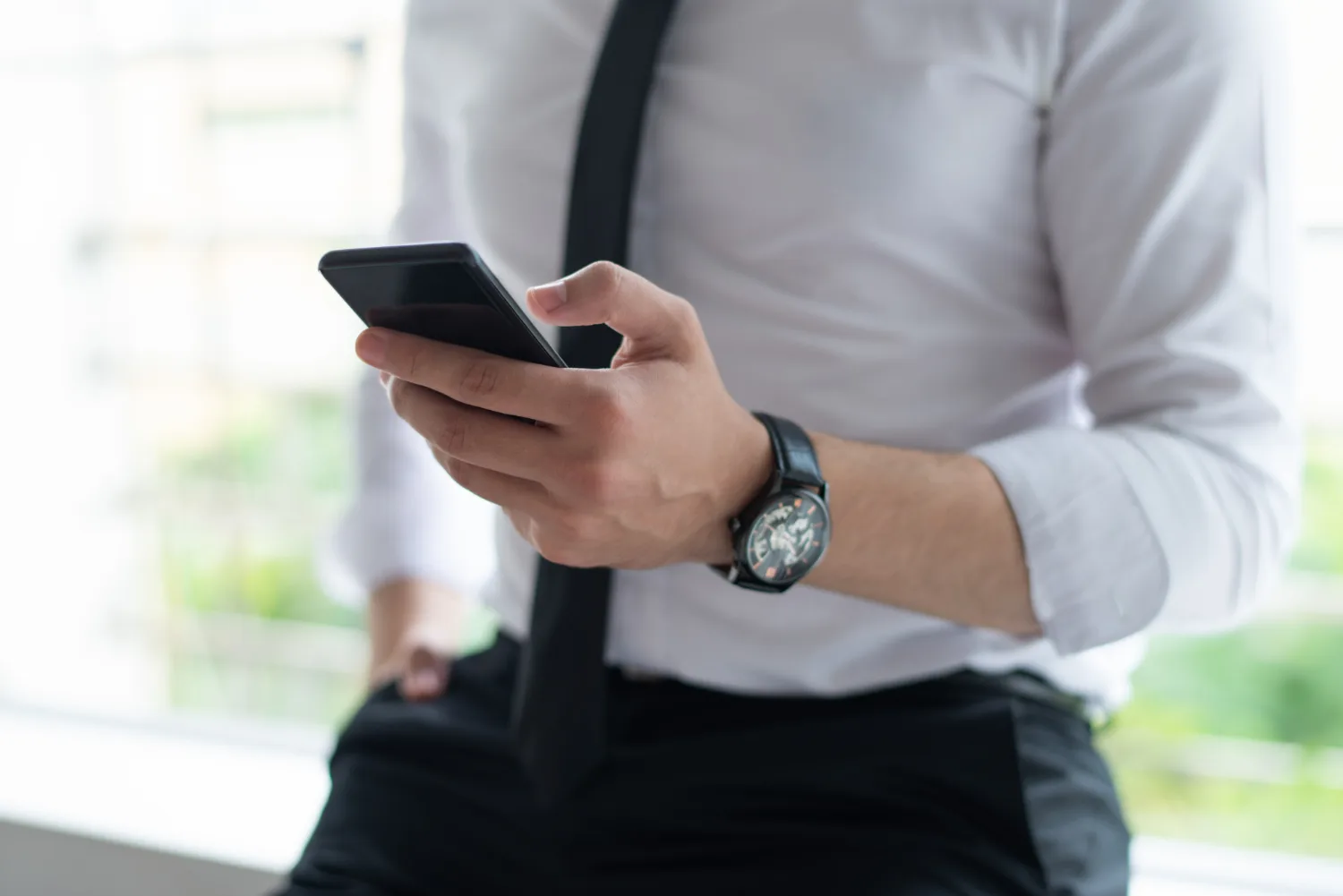Employee dressed in office attire representing mobile time tracking on the go