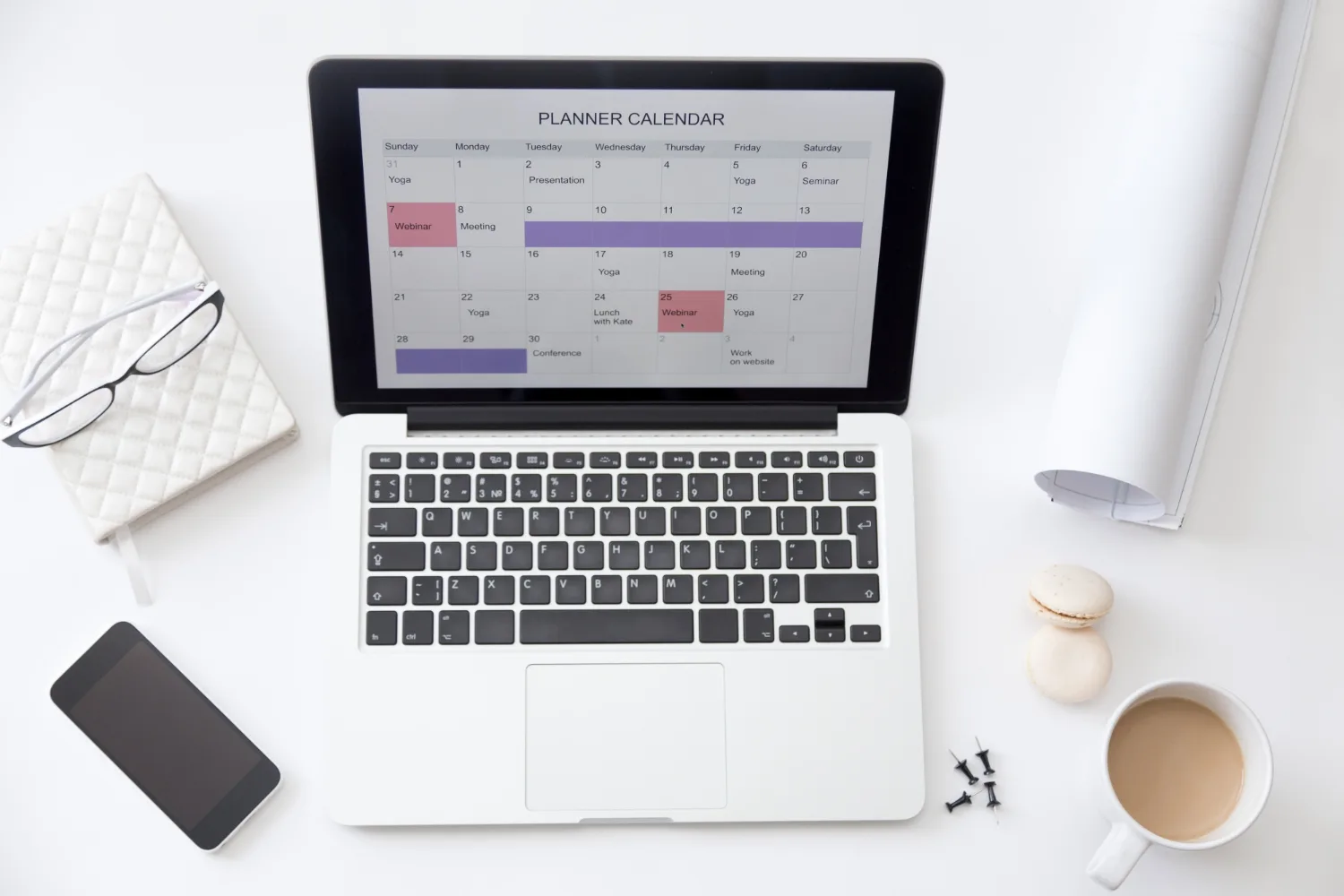 Laptop screen displaying employee shift planning calendar